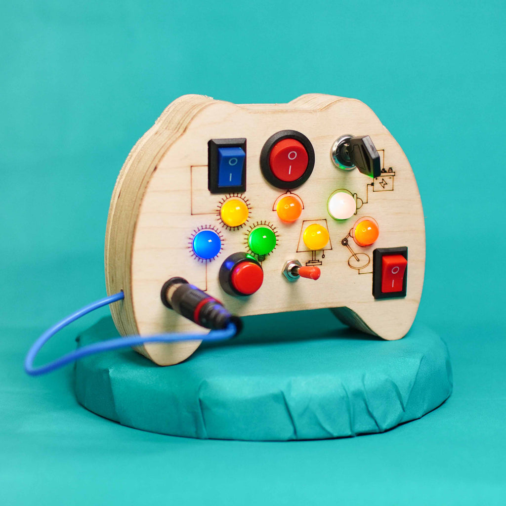 Side view of the wooden busy board showing toggle switches