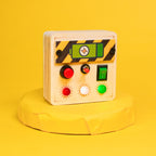 Side view of the Toddler Montessori Portable Switches Busy Board Mini Version, showcasing its compact design and portable features.