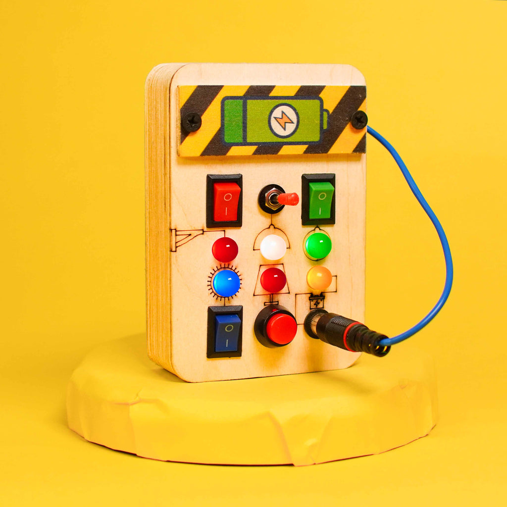 Close-up of toggle switches and LED lights on the Montessori Portable Spark Switches Wooden Busy Board V1, showcasing its engaging design for toddlers.