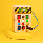 Close-up of toggle switches and LED lights on the Montessori Portable Spark Switches Wooden Busy Board V1, showcasing its engaging design for toddlers.
